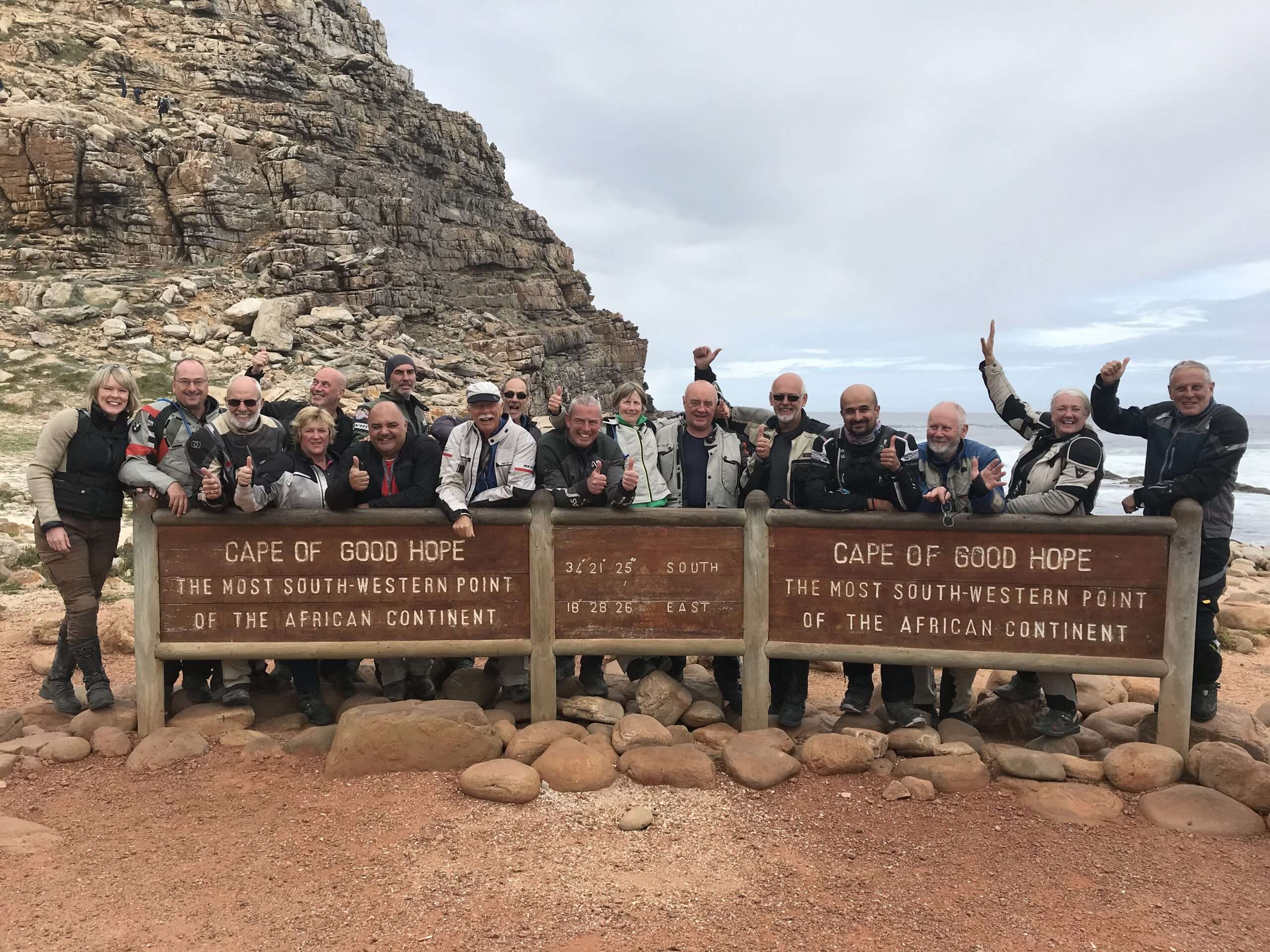 South Africa Garden Route Motorcycle Tour 2 South Africa Motorcycle Tour, group of motorcyclists standing behind Cape of Good Hope Sign